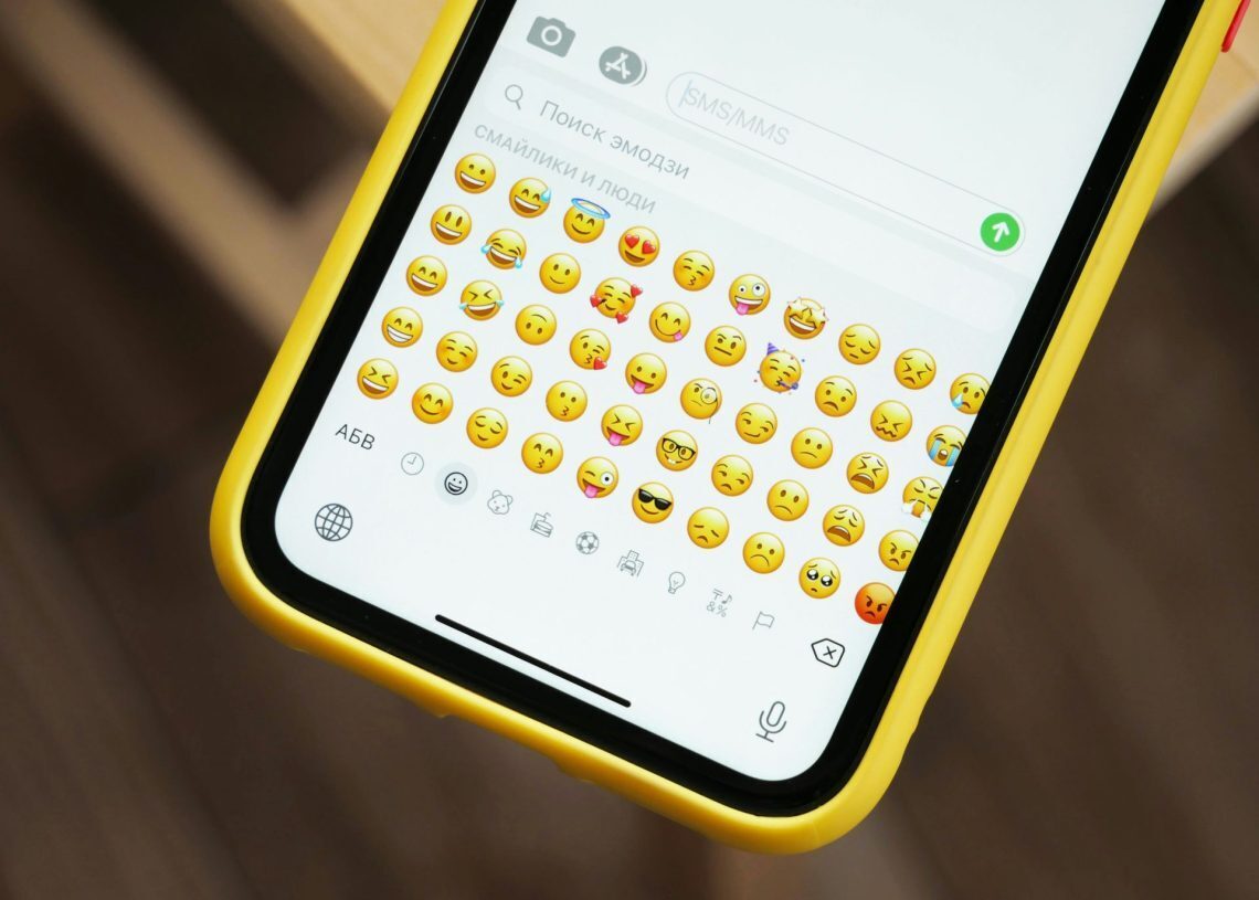 How do you use the iMessage emoji layer feature?